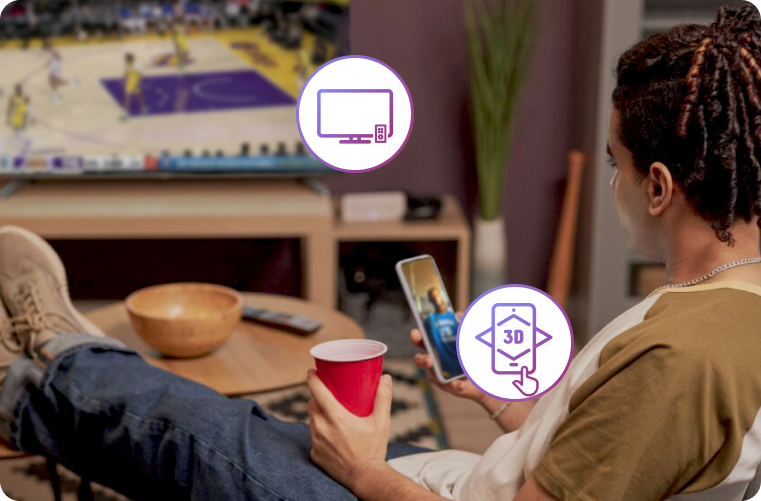 Person watching TV with phone